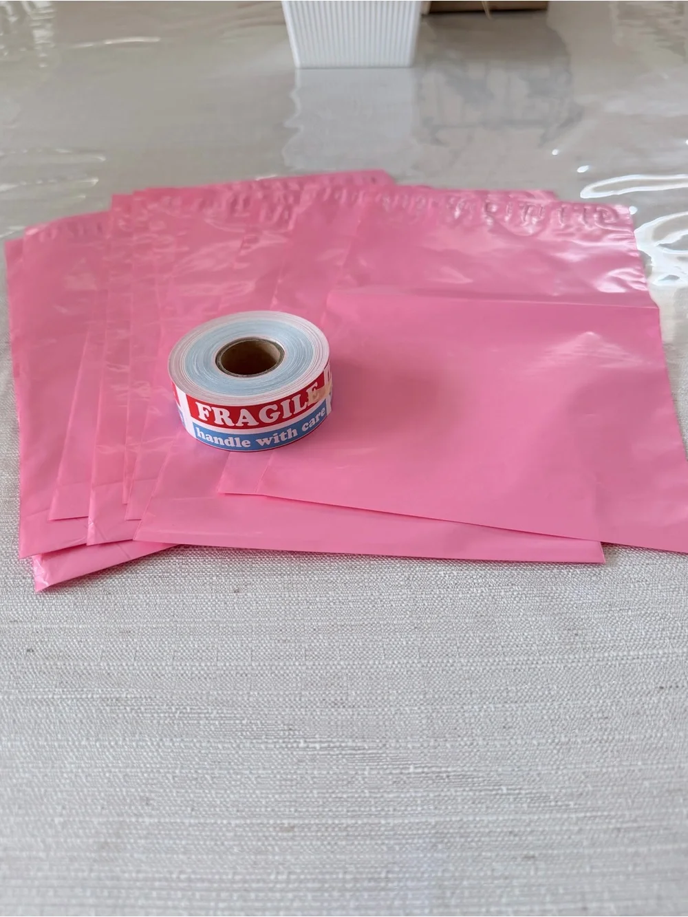 15 pink polys 6in x 9in and 300 (3in x 1in) fragile stickers bundle